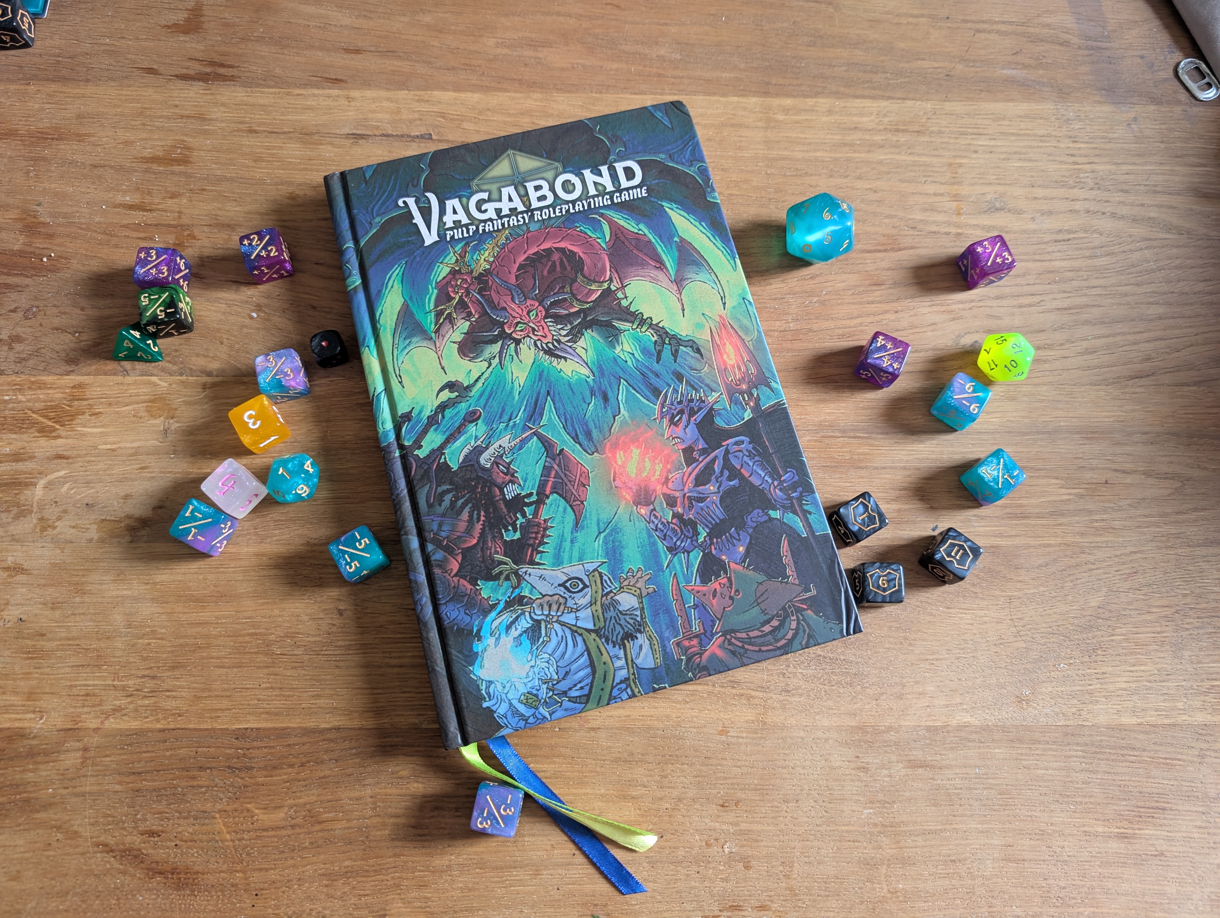 Vagabond rulebook and dice